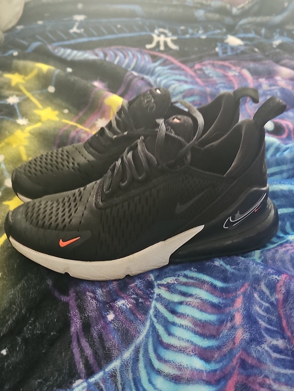 Nike Black Sneakers with Orange Accent and White Sole